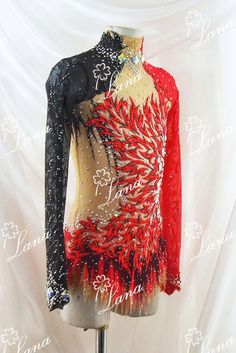 a red and black dress with sequins on it