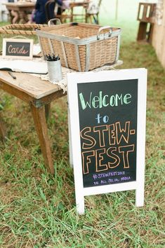 a sign that says welcome to stew fest in front of some tables with baskets on them