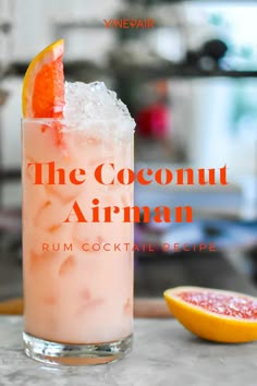 the coconut airman rum cocktail is served with an orange slice and garnish