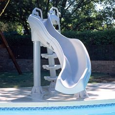 a water slide in the middle of a swimming pool