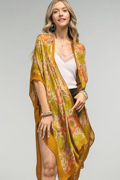 Introducing the Hilary Kimono - a stunning piece that combines vintage charm with modern elegance. Its airy fabric is adorned with a gorgeous floral and leaf print, while side slits add a touch of movement. Elevate any outfit with this unique and versatile kimono. *100% Viscose*APPROX. L 38" W 40" Madewell Style, Bohemian Kimono, Anthropologie Style, Floral Print Kimono, Beach Kimono, Blue Kimono, Free People Style, Print Kimonos, Vintage Floral Print