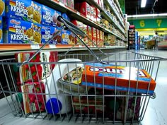 an empty shopping cart in a grocery store