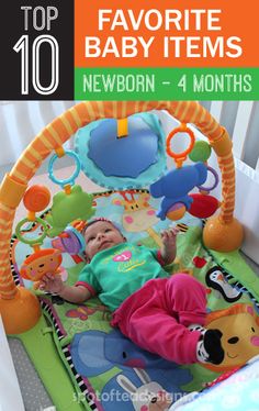 a baby laying in a play mat with toys