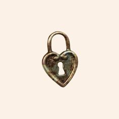 an old padlock with a heart shaped lock