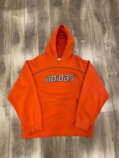 Description: Adidas distressed spellout hoodie Flaws: Distressing on sleeves/hood, holes on front, please see pictures Size: L Length: 28" Pit to Pit: 24.5" Sleeve: 23.5" Brand: Adidas Era: 2010s Color: Orange Store Item #IN320 Orange Store, Adidas Hoodie Mens, Adidas Hoodie, Picture Sizes, Color Orange, Adidas, Orange, Sweatshirts, Color