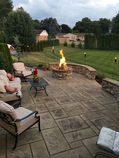 a fire pit in the middle of a patio