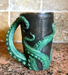 an octopus coffee mug sitting on top of a counter