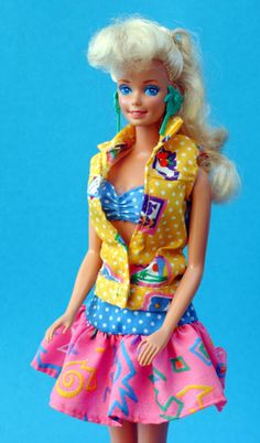 a barbie doll with blonde hair wearing a colorful dress and yellow polka dot shirt on