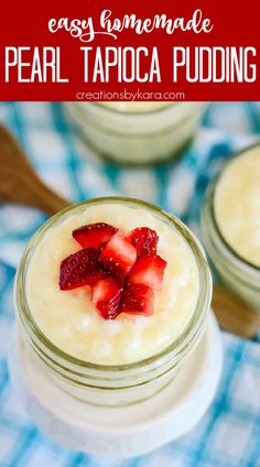 two small jars filled with pudding and strawberries on a blue checkered table cloth