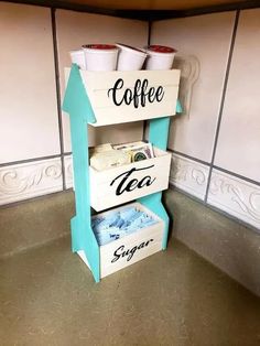 three boxes stacked on top of each other with coffee cups in them