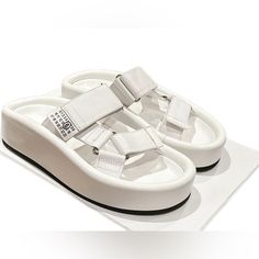 Size Us8 Luxury Platform Slip-on Sandals, Modern White Sandals With Heel Loop, Luxury Slides With Platform And Round Toe, Luxury Slip-on Platform Sandals, White Platform Slip-on Sandals, White Leather Slip-on Platform Slippers, White Leather Platform Slippers For Spring, Luxury Synthetic Platform Sandals, Luxury Platform Slides For Summer