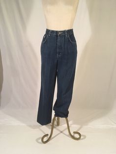 "vintage 1980s high waist blue jeans Normandee Rose, made in Hong Kong cotton zipper fly 5 pockets embroidered rose on welt pocket relaxed fit, tapered leg good vintage condition, lightly worn in labeled 15, see below measures, lying flat, waist-13 1/2\" rise-12 1/2\" hip-21\" inseam-30\" hem-8\" outseam-41 1/2\"" Spring Vintage Rigid Denim Pants, Retro High-waist Rigid Denim Bottoms, Vintage Blue Relaxed Fit Bottoms, Vintage High-waist Rigid Denim Bottoms, Vintage Dark Wash Rigid Denim Pants, Tapered Legs, Hong Kong, Blue Jeans, Mom Jeans