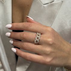 a woman's hand with a ring on it