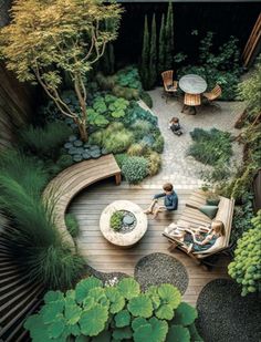 an aerial view of a garden with people sitting on chairs and tables in the center