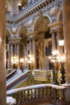 an ornate building with many columns and chandeliers