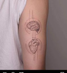 a person with a tattoo on their arm that has an image of a heart and brain