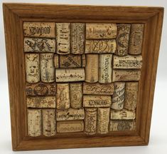 a wooden frame filled with lots of wine corks