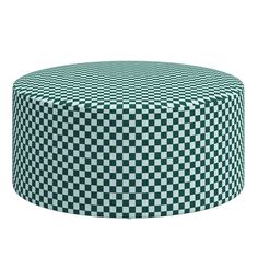 a green and white checkerboard pattern on a round tablecloth that has been placed in front of a white background