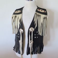 VINTAGE ORIGINAL RODEO WESTERN LEATHER VEST FRINGE STUDDED SMALL / MEDIUM 1960S / 1970S COLOR : BLACK SIZE :  SMALL / MEDIUM (size on tag is not visible so please check measurement below ) Arm Pit to Arm pit : 18.5' inches Neck to Bottom : 17.5' inches Shoulder to Shoulder : 15' inches  CONDITION : VERY GOOD VINTAGE CONDITION OVERALL BUT PLEASE CHECK ALL PICTURES  Please check my ebay Store KING OF VINTAGE ! ( click the icon)  Shipping Worldwide ! Western Vest, Western Leather, Country Western, Leather Vest, Western Wear, Leather Craft, Rodeo, Medium Size, Dream Catcher