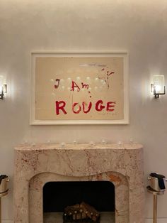 a room with a fire place and pictures on the wall above it that says i am rouege