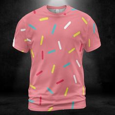 Pink Donut Sprinkles Unisex Comfort T-Shirt. Add some cuteness and fun to your t-shirt collection with this colorful Pink Donut Sprinkles Unisex Comfort T-Shirt design. Features a pink color background with multicolored sprinkles all over the shirt. It looks great on this tee shirt! This design is sure to grab attention. Product Details Step out with an instant classic! Dressed up or down, our unisex t-shirt offers complete comfort and style. Handmade with premium wear-resistant fabric, show off your style with this carefully crafted tee. -95% Polyester And 5% Spandex -4 Way Stretch -Light Fabric -Soft, breathable fabric -Crewneck -Double-needle topstitch detailing -Printed, cut, and handmade   Size & Fit   -Unisex sizing for men and women -Moderate stretch -Sizes: S-5XL Playful Short Sleeve T-shirt With All Over Print, Playful Colorful Crew Neck T-shirt, Cute Pink T-shirt With Graphic Print, Playful Pink Short Sleeve T-shirt, Playful Cartoon Print Crew Neck T-shirt, Pink Crew Neck Top With All Over Print, Pink All-over Print Crew Neck Tops, Funny Multicolor Short Sleeve T-shirt, Playful Crew Neck T-shirt With Cartoon Print