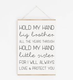 a sign hanging on the wall that says hold my hand and hug brother all the years through