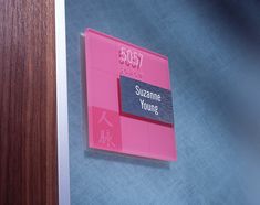 there is a pink sign on the door to someone's room that says suzeme young