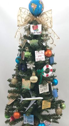 a small christmas tree decorated with ornaments