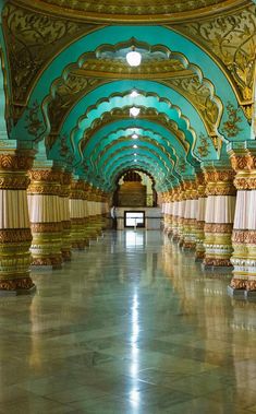 an ornately decorated hallway with columns and pillars