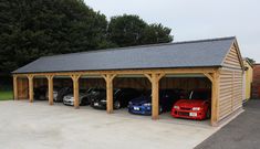 a garage with several cars parked in it and attached to the side of the building