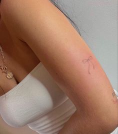 a woman with a small tattoo on her arm