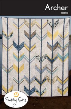 an image of a quilt on the cover of a book with arrows in blue, yellow and