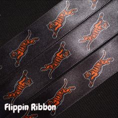 a black tie with orange tiger designs on it