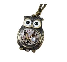 "A high quality watch movement has been adorned with a Swarovski crystal has been set upon an adorable owl watch fob Pendant. The pendant suspends from a nice bronze link chain. Watch movement may vary. This is not an actual watch, the movement no longer works. Measures: 30\" long Pendant: 1\" x 1 1/4\"" Steampunk Owl, Steampunk Owls, Chain Watch, Owl Necklace, Long Pendant, Watch Movement, Link Chain, Antique Bronze, Swarovski Crystal