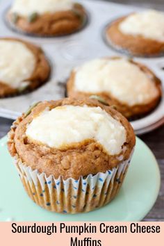 cupcakes with cream cheese frosting in muffin tins