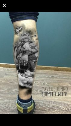 a man's leg with an image of a ship on it