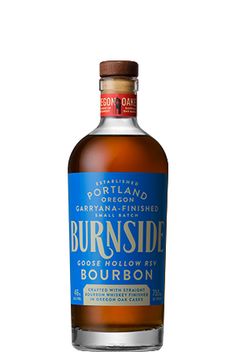 a bottle of burnside bourbon on a white background with clippings for text