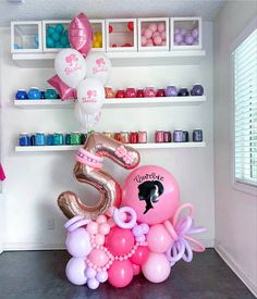 balloons are arranged in the shape of an elephant and number five, along with other decorations