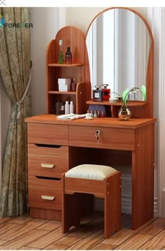 a wooden dressing table with mirror and stool