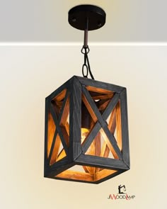 a wooden light fixture hanging from the ceiling