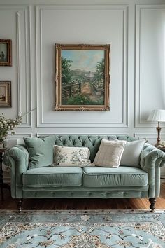 a living room filled with furniture and a painting on the wall