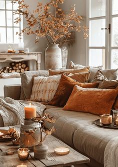 a living room filled with lots of furniture and candles