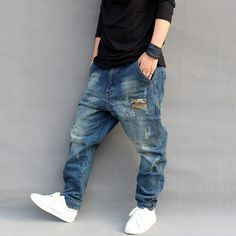 Hip Hop Blue Distressed Bottoms, Baggy Distressed Blue Jeans, Baggy Medium Wash Hip Hop Jeans, Hip Hop Baggy Medium Wash Jeans, Baggy Hip Hop Jeans In Medium Wash, Baggy Distressed Blue Cargo Jeans, Distressed Blue Jeans In Hip Hop Style, Distressed Blue Jeans Hip Hop Style, Blue Distressed Hip Hop Jeans