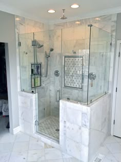 a walk in shower sitting inside of a bathroom