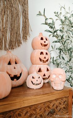 some carved pumpkins are sitting on a table