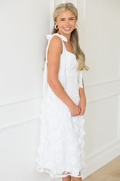 If you're a summer bride, this white midi is a stunning choice for any showers or your rehearsal dinner! The flirty bustier style top is fitted through the waist and falls into an A-line skirt. The ribbon straps are adjustable, and a full liner ensures a smooth, opaque fit.  Fully lined Back zip closure Adjustable tie straps  Fabric content: Shell & Lining- 100% polyester. Contrast- 100% cotton Fabric has no stretch Fit... White Bridesmaid Dress With Bow Straps, Summer Bridal Shower Dress With Sweetheart Neckline, White Prom Dress With Delicate Straps, White Strapless Tie-back Dress, White Dress With Sweetheart Neckline And Bow Straps, White Dress With Bow Straps And Sweetheart Neckline, White Strapless Dress With Tie Back, White Dresses With Knotted Spaghetti Straps, White Dress With Knotted Spaghetti Straps