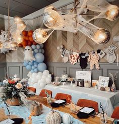 a dining room with balloons and decorations hanging from the ceiling