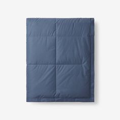 an image of a blue comforter on a white background in the shape of a square