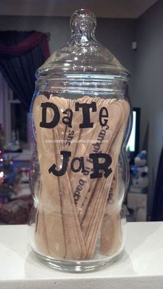 a jar that has some wooden spoons in it with the words date and jor on it