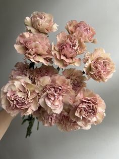 a bunch of pink flowers in a vase